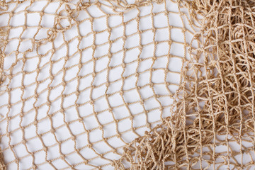 Fishnet on white background. Fishing net. Texture fishnet, seine. Dragnet, drag, trammel, sweep-net