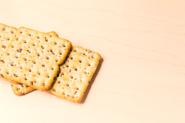 Full-grain cereal biscuits on light background and space for text.