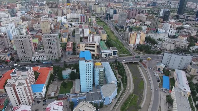 Aerial drone shot over a district in Ulaanbaatar mongolia. Discovering mountains