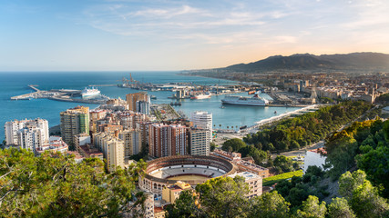 Aerial panoramic view of Malaga city, Andalusia, Spain in a beautiful summer day - obrazy, fototapety, plakaty