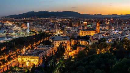 Fototapeta na wymiar Aerial panoramic view of Malaga city, Andalusia, Spain after beautiful sunset