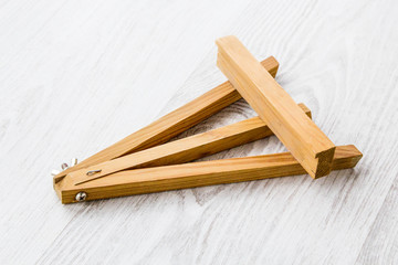 Wooden easel on white background