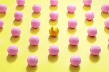 Vivid colorful 3d rendering volleyballs background.There's a golden volleyball in the middle, the concept of the focal point and focus.