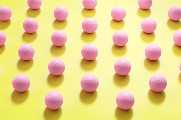 Vivid colorful 3d rendering volleyballs background.