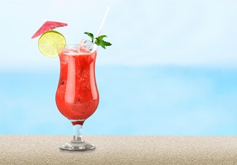 Glass of alcohol cocktail on bar background,