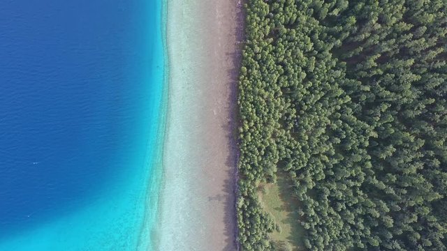 Aerial drone shot from top view border forest beach lake khuvsgul in Mongolia