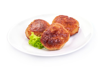 Roasted Turkey meatballs with lettuce, close-up, isolated on a white background