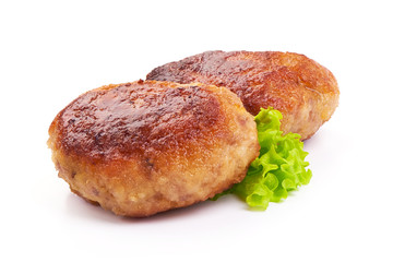Roasted Turkey meatballs with lettuce, close-up, isolated on a white background.