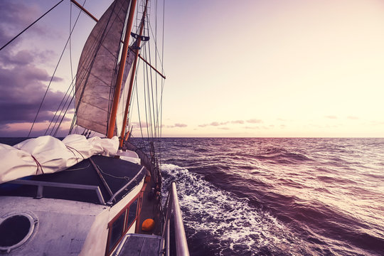 Old Sailing Ship At Sunset, Travel And Adventure Concept, Color Toned Picture.