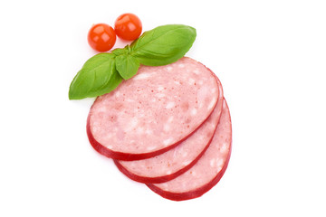 Thinly sliced Italian smoked Salami sausage with basil leaves, close-up, isolated on a white background