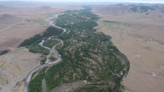 Aerial drone shot of a river in Mongolia high altitude Cloudy day