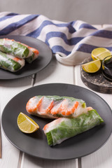 Fresh spring rolls on a plate with lime