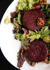 Beetroot steak salad with blue cheese sauce, grapes and walnuts