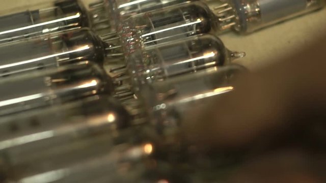 man makes up a series of vacuum tubes