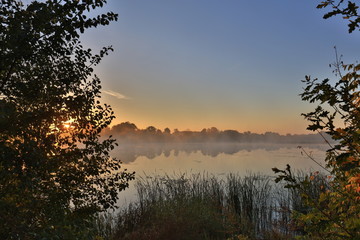 Early morning, sunrise over the lake. Rural landscape. HDR
