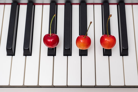 Piano chord shown by cherries on the key - F#/Gb