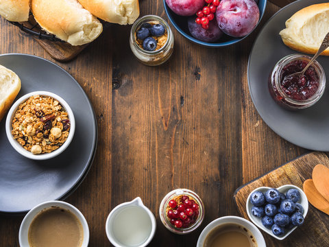 Cozy Breakfast concept on dark wooden textured background. Food frame flat lay