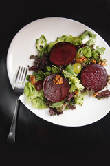 Beetroot steak salad with blue cheese sauce, grapes and walnuts