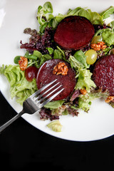 Beetroot steak salad with blue cheese sauce, grapes and walnuts