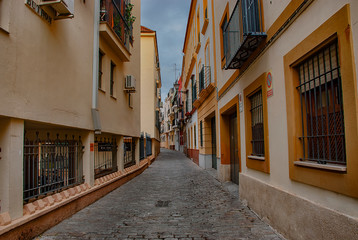 Building exteriors along the narrow streets of Seville, Spain