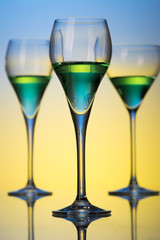 three glasses with cocktails