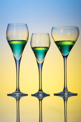 three glasses with cocktails