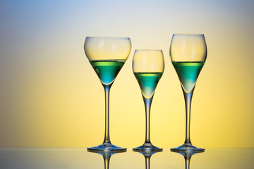 three glasses with cocktails