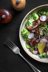 Beef salad with radish, peach and green vegetables