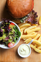 Vegan burger with salad, and french fries
