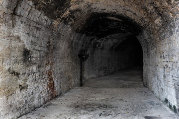 Old abandoned tunnel in the underground wine cellar. Entrance to the catacombs in Odessa, Ukraine....