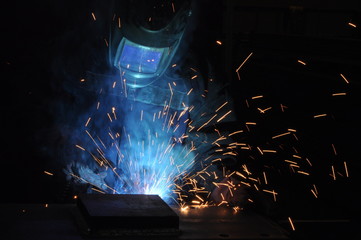 electric welder brews steel at the factory