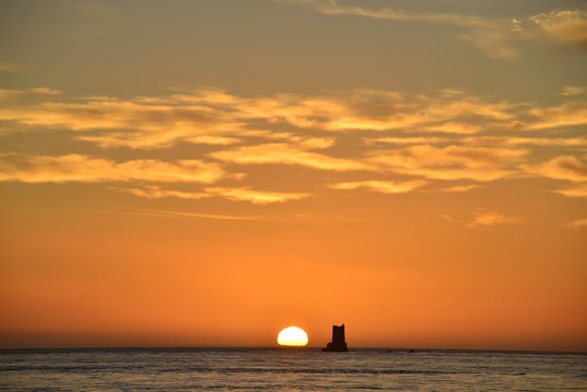 Fototapeta Seymour tower, Jersey, U.K.  Autumn sunrise over the sea.