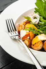 Fresh Sicilian Salad with shrimps, arugula, cheese and ripe orange slices.