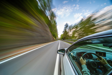 Plakat Car in motion blur driving in the Mountains