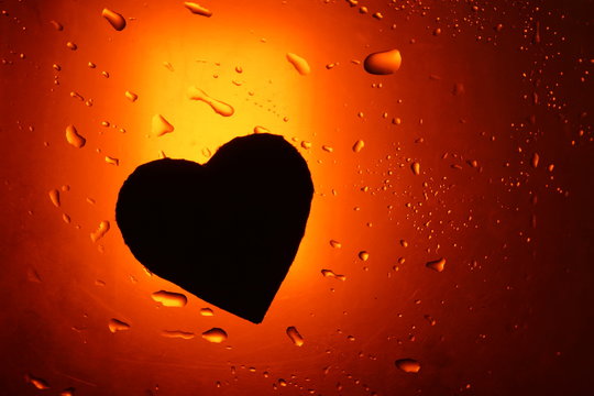 abstract water drop background red orange light spot heart silhouette