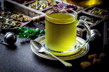 Tea in a cup on an old background
