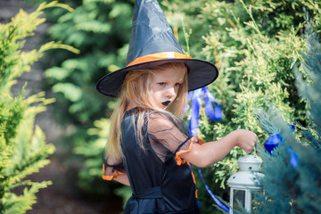 Happy girl in halloween costume with jack pumpkin.Trick or treat