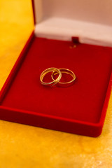 Wedding rings on a red stand