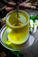 Tea in a cup on an old background