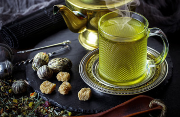 Tea in a cup on an old background