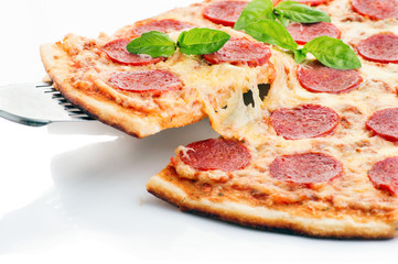 Tasty Pepperoni pizza with sausage from the top on white background.