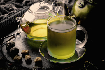 Tea in a cup on an old background