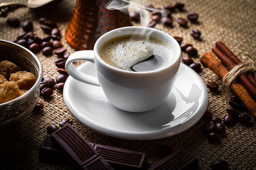 Black coffee in a composition with kitchen accessories