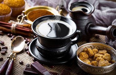 Black coffee on old background