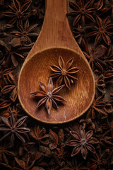 anise in a wooden spoon. Top view. Copy space.