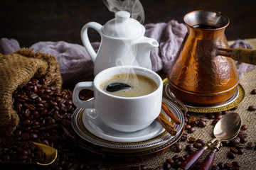 Black coffee in a composition with kitchen accessories