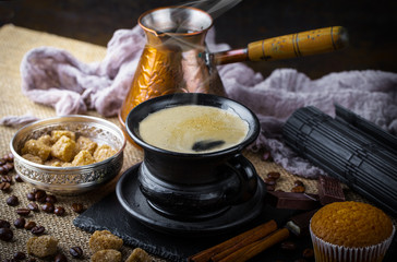 Black coffee in a composition with kitchen accessories