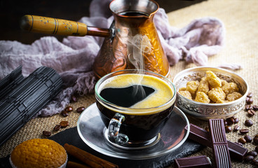 Black coffee on old background