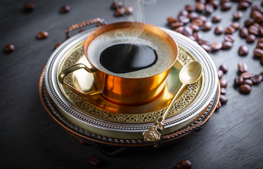 Black coffee on old background