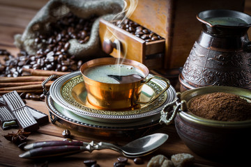 Black coffee on old background